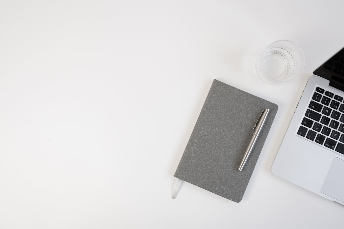 Laptop and Notebook on White Background